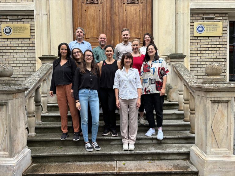 ETH-TECH project team on the steps of a Babeș-Bolyai University building in Cluj-Napoca